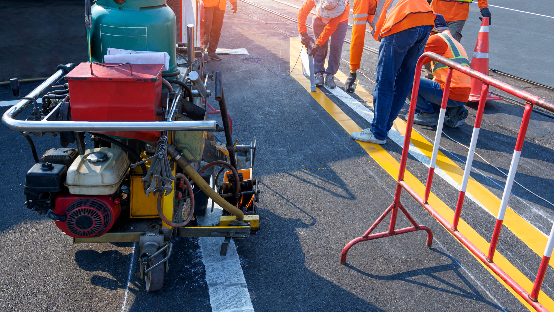 medium-vecteezy_road-workers-group-with-thermoplastic-spray-road-marking_6982805_medium